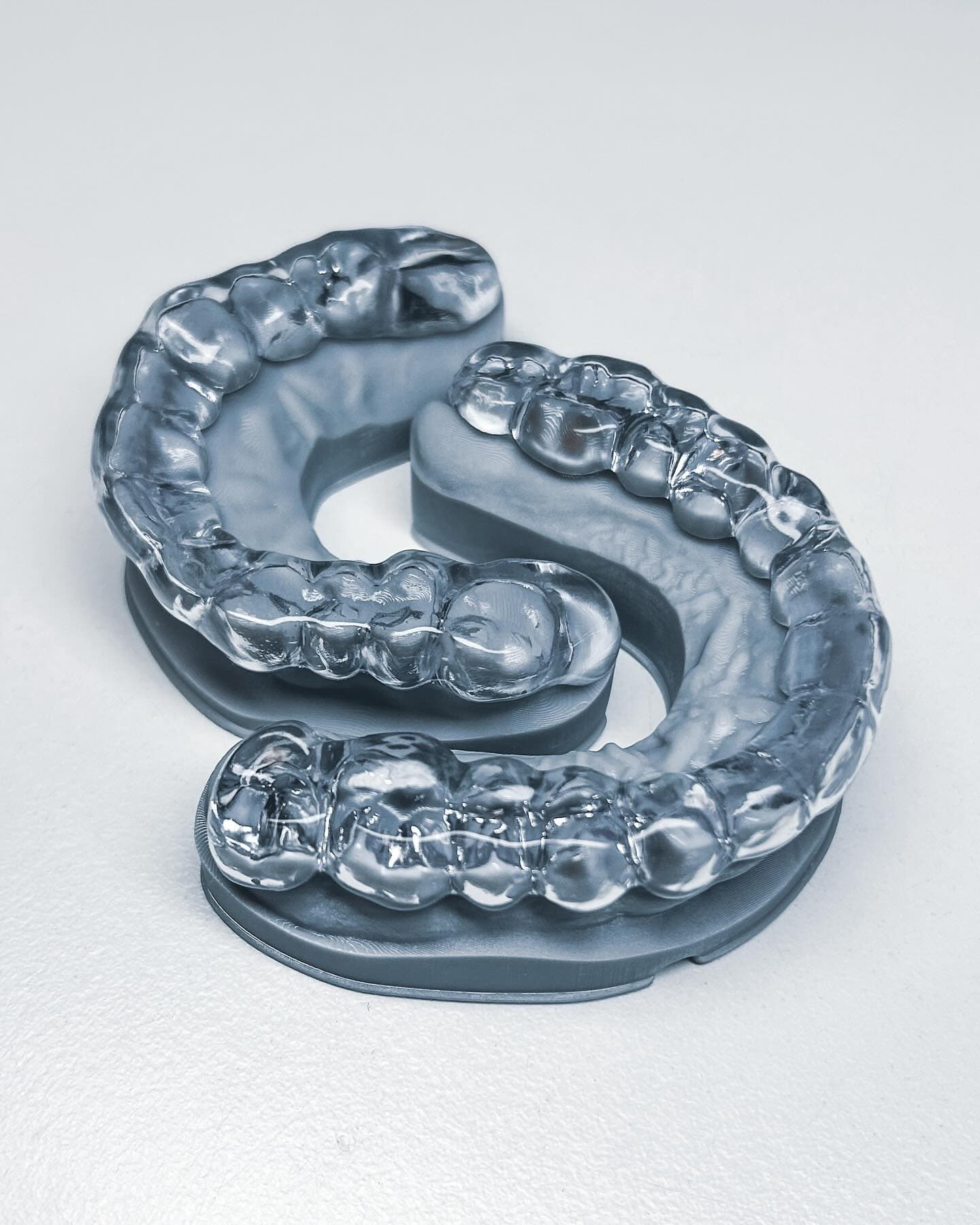 Clear orthodontic aligners on 3D printed dental models produced by NordicDens